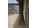 Fenced patio with concrete flooring along the side of the property with extra storage at 3807 W Mitchell Dr, Phoenix, AZ 85019