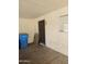 Attached storage with door and window near an area for garbage and recycling cans at 3807 W Mitchell Dr, Phoenix, AZ 85019