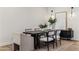 Dining room with modern light fixture, table with seating for six, and neutral decor at 3848 E Fairmount Ave, Phoenix, AZ 85018