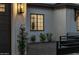 Close up showing front exterior with white brick, a dark frame window and lovely landscape details at 3848 E Fairmount Ave, Phoenix, AZ 85018