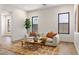 Inviting living room boasts a cozy sofa, decorative pillows, and stylish rug at 3848 E Fairmount Ave, Phoenix, AZ 85018