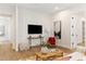 Open-concept living area with wood floors and cozy furnishings at 3848 E Fairmount Ave, Phoenix, AZ 85018