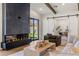 Bright and airy living room with a modern fireplace, sliding glass doors, and an open floor plan at 3848 E Fairmount Ave, Phoenix, AZ 85018