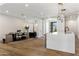 Open-concept living space with seamless transition to the kitchen and dining area, with high-end finishes at 3848 E Fairmount Ave, Phoenix, AZ 85018