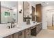 Main bathroom boasts double sinks, quartz counters, and a tiled glass shower at 3848 E Fairmount Ave, Phoenix, AZ 85018