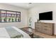 Bright main bedroom with hardwood floors, stylish rug, and a private entrance at 3848 E Fairmount Ave, Phoenix, AZ 85018