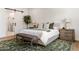 Cozy main bedroom with hardwood floors, stylish rug, and decorative lamps at 3848 E Fairmount Ave, Phoenix, AZ 85018