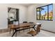 Bright office features a wood desk and a large window with neighborhood view at 3848 E Fairmount Ave, Phoenix, AZ 85018