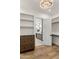 Large walk-in closet leads to the main bathroom and features built-in shelving at 3848 E Fairmount Ave, Phoenix, AZ 85018