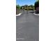 Gated community entrance with decorative wrought iron gate and manicured landscaping at 3900 E Baseline Rd # 166, Phoenix, AZ 85042