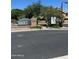 Attractive community signage at the entrance with well-maintained landscaping at 3900 E Baseline Rd # 166, Phoenix, AZ 85042