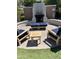 Cozy community outdoor fireplace with comfortable seating and inviting ambiance at 3900 E Baseline Rd # 166, Phoenix, AZ 85042