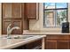 Bright kitchen featuring stainless steel appliances and a double sink at 3900 E Baseline Rd # 166, Phoenix, AZ 85042