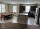 Spacious kitchen featuring stainless steel appliances and an island, open to dining area at 3900 E Baseline Rd # 166, Phoenix, AZ 85042