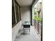 Relaxing outdoor patio with seating, view of landscaped greenery, and modern railing at 3900 E Baseline Rd # 166, Phoenix, AZ 85042