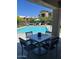 Comfortable poolside lounge area with ample seating and umbrella shade at 3900 E Baseline Rd # 166, Phoenix, AZ 85042