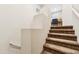 Carpeted stairway leading to the upper level of the home with natural light at 3900 E Baseline Rd # 166, Phoenix, AZ 85042