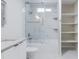 Bright bathroom features a modern shower and built-in shelving at 4116 W Marshall Ave, Phoenix, AZ 85019