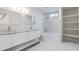 Bright bathroom features double sinks, a framed mirror, and a tub/shower combo at 4116 W Marshall Ave, Phoenix, AZ 85019