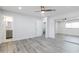 Bright bedroom features a ceiling fan, recessed lighting, walk-in closet, and light gray flooring at 4116 W Marshall Ave, Phoenix, AZ 85019