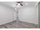 Bright bedroom features a ceiling fan, recessed lighting, and light gray flooring at 4116 W Marshall Ave, Phoenix, AZ 85019