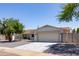 Charming single-story home with a well-manicured front yard and a two-car garage at 4116 W Marshall Ave, Phoenix, AZ 85019