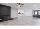 Open-concept living area showcasing a fireplace and leading to the kitchen and entryway at 4116 W Marshall Ave, Phoenix, AZ 85019