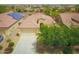 Aerial view of a single Gathering home with a well manicured desert landscape, tile roof, and spacious driveway at 41162 W Hayden Dr, Maricopa, AZ 85138