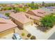 Aerial view of a single Gathering home with a desert landscape, tile roof, and a spacious driveway at 41162 W Hayden Dr, Maricopa, AZ 85138