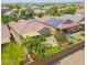 Backyard aerial view featuring desert landscaping, a covered patio, and a small patch of grass at 41162 W Hayden Dr, Maricopa, AZ 85138
