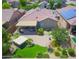 Aerial view of an outdoor patio with a spa, seating, and manicured desert landscaping at 41162 W Hayden Dr, Maricopa, AZ 85138