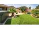 Backyard featuring desert landscaping, gravel, artificial turf, and a hot tub at 41162 W Hayden Dr, Maricopa, AZ 85138