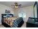 Bedroom with a fan and large window allowing for natural light at 41162 W Hayden Dr, Maricopa, AZ 85138
