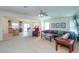 Open concept living room featuring neutral colors, a ceiling fan, and modern decor at 41162 W Hayden Dr, Maricopa, AZ 85138