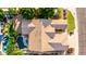 Aerial view of the backyard, highlighting the beautiful tile roof, outdoor living space, and swimming pool at 4215 W Hackamore Dr, Phoenix, AZ 85083
