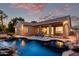 Backyard featuring a pool with a waterfall, lounge area, and covered patio at 4215 W Hackamore Dr, Phoenix, AZ 85083