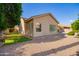 Charming single-story home with a gravel area, lush grass, and manicured landscaping at 4215 W Hackamore Dr, Phoenix, AZ 85083