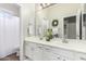 Bathroom featuring double vanity, large mirror, and a tub shower combo at 4215 W Hackamore Dr, Phoenix, AZ 85083