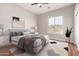 Serene bedroom featuring neutral tones, large window, stylish decor, and a comfortable bed at 4215 W Hackamore Dr, Phoenix, AZ 85083
