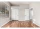 Bright bedroom features a window, wood-look flooring, closet, and neutral paint at 4215 W Hackamore Dr, Phoenix, AZ 85083
