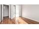 Bedroom featuring wood-look flooring and closet with sliding doors at 4215 W Hackamore Dr, Phoenix, AZ 85083