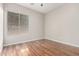Bedroom with hardwood flooring, a ceiling fan, and a large window at 4215 W Hackamore Dr, Phoenix, AZ 85083