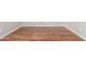 Hardwood floors in room with baseboards, outlets and neutral paint at 4215 W Hackamore Dr, Phoenix, AZ 85083