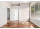 Bright bedroom with hardwood floors, a closet, and a window at 4215 W Hackamore Dr, Phoenix, AZ 85083