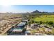 Aerial view of community park featuring tennis courts, playground and athletic field with mountain views at 4215 W Hackamore Dr, Phoenix, AZ 85083
