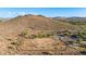 Community dog park with divided areas, mature shade trees and park benches nestled at the base of the mountains at 4215 W Hackamore Dr, Phoenix, AZ 85083