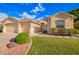 Charming single-story home featuring a well-manicured lawn, two-car garage, and inviting entrance at 4215 W Hackamore Dr, Phoenix, AZ 85083