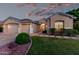 Charming single-story home featuring a well-manicured lawn, two-car garage, and inviting entrance at 4215 W Hackamore Dr, Phoenix, AZ 85083