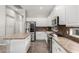 Bright, updated kitchen features white cabinets, stainless steel appliances, and a functional center island at 4215 W Hackamore Dr, Phoenix, AZ 85083