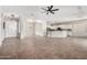 Bright, open living space with modern lighting, a kitchen view, and great flow for entertaining at 4215 W Hackamore Dr, Phoenix, AZ 85083